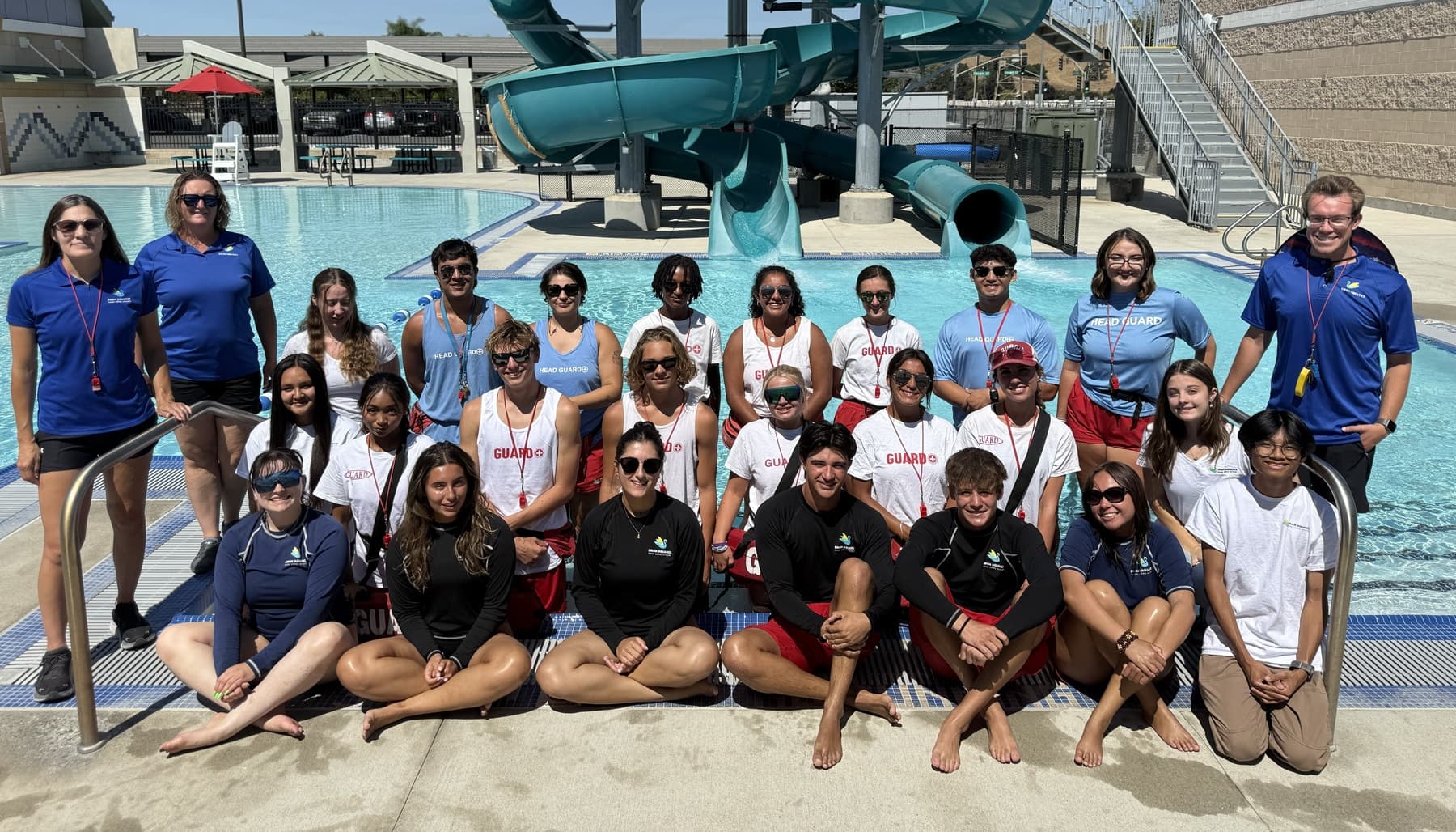 Swan Aquatics lifeguards and staff in guard tees, rash guards and polos at the Gilroy pool